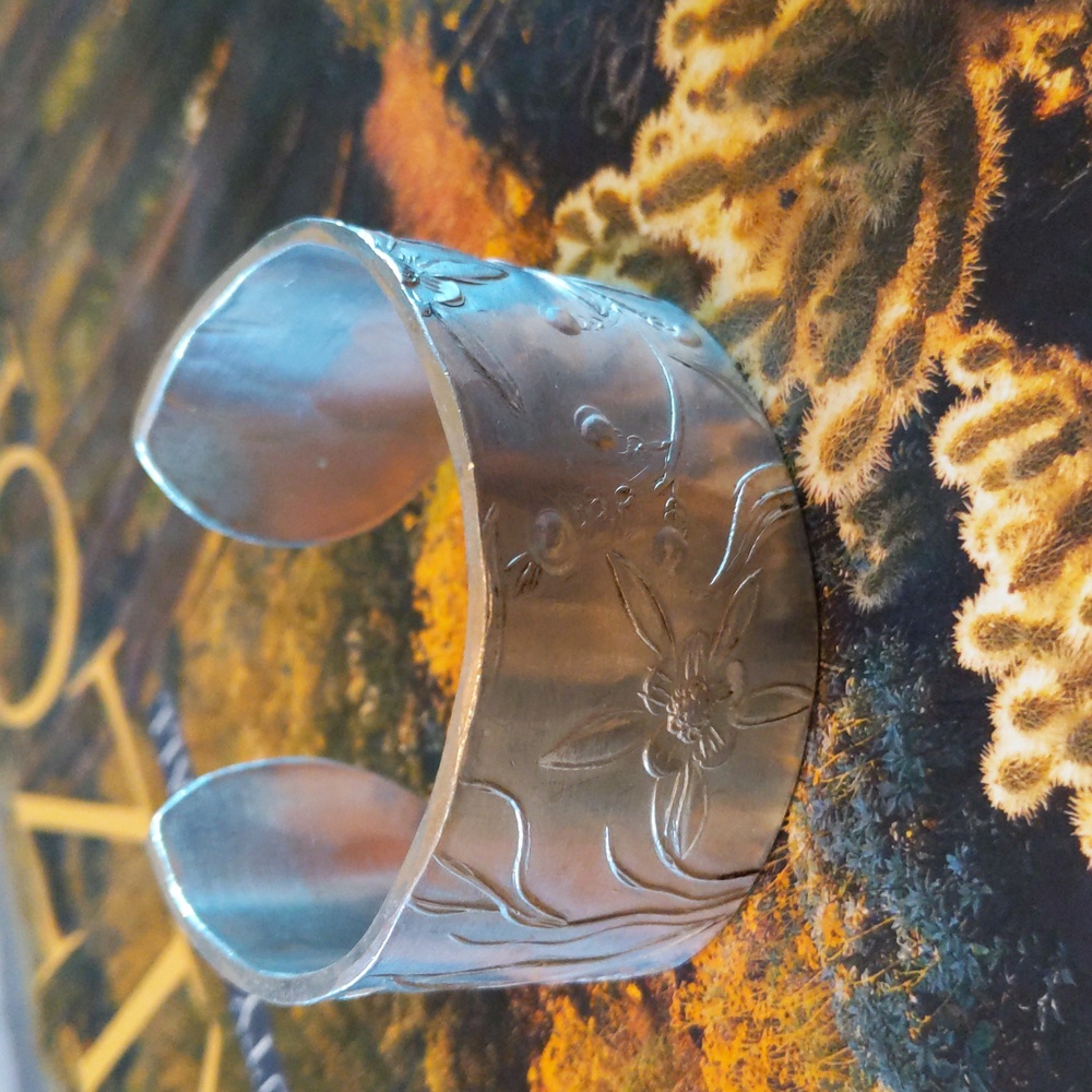 Embossed metal cuff bracelet